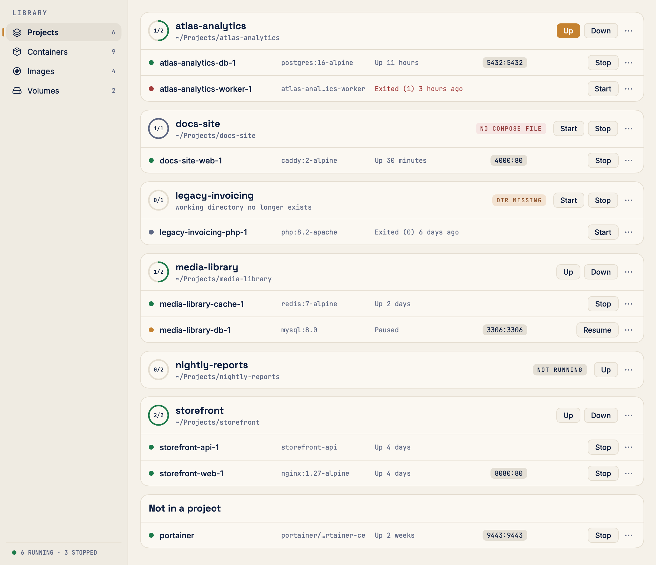 The Projects screen: six compose projects, each a card with a run ring, its folder, and Up and Down buttons.